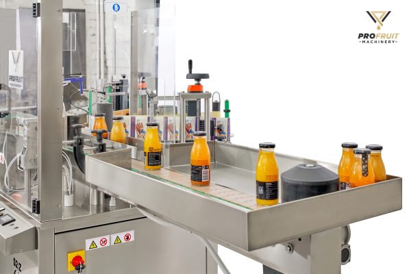 Semi-automatic bottle labeling machine from up close